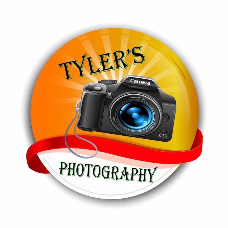 An early circular logo design for a photography business, with a camera icon and a ribbon banner